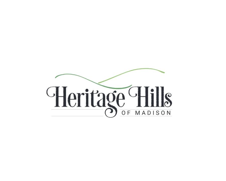 A logo of heritage hills of madison